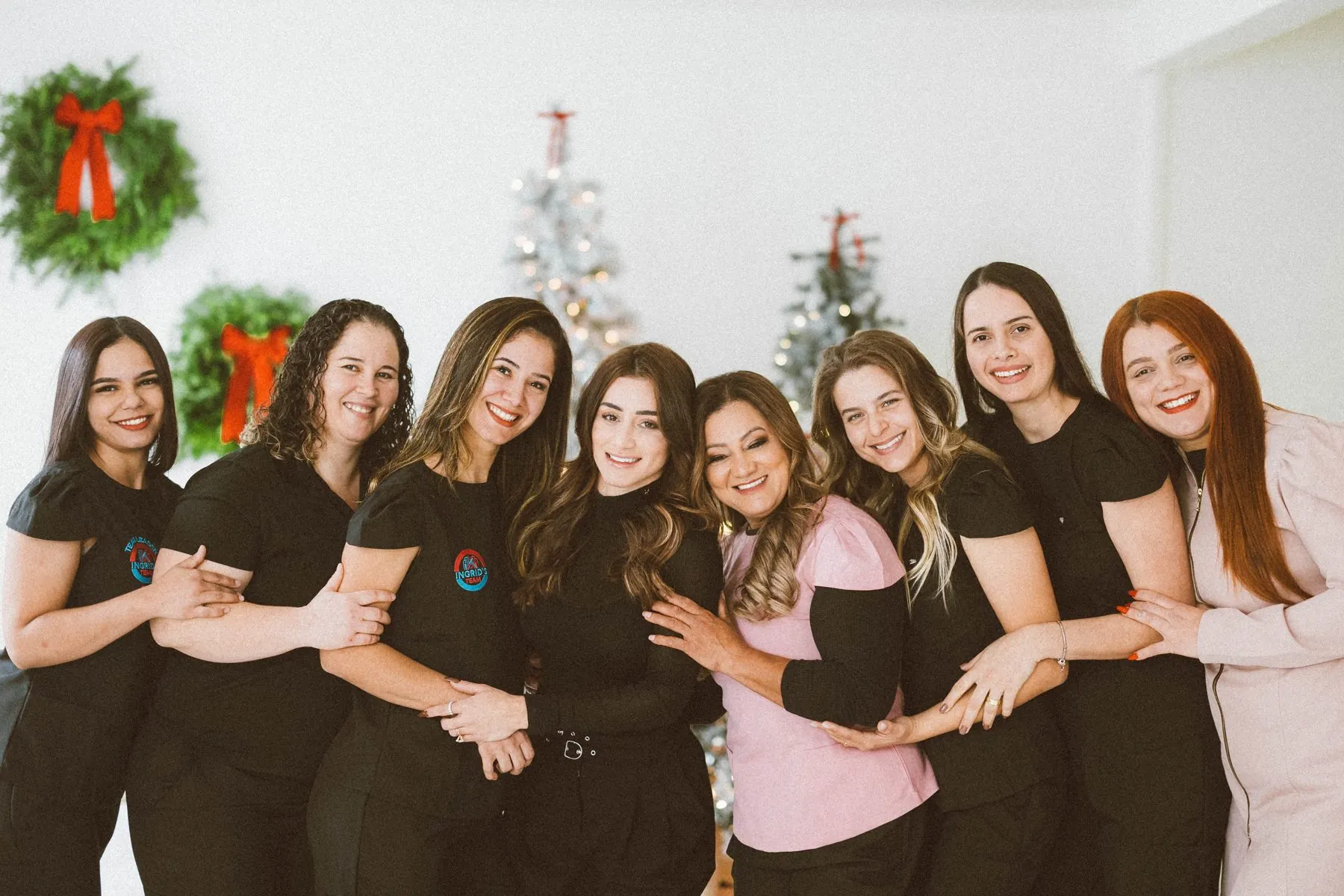 The Ingrid's Team crew smiling together arm in arm