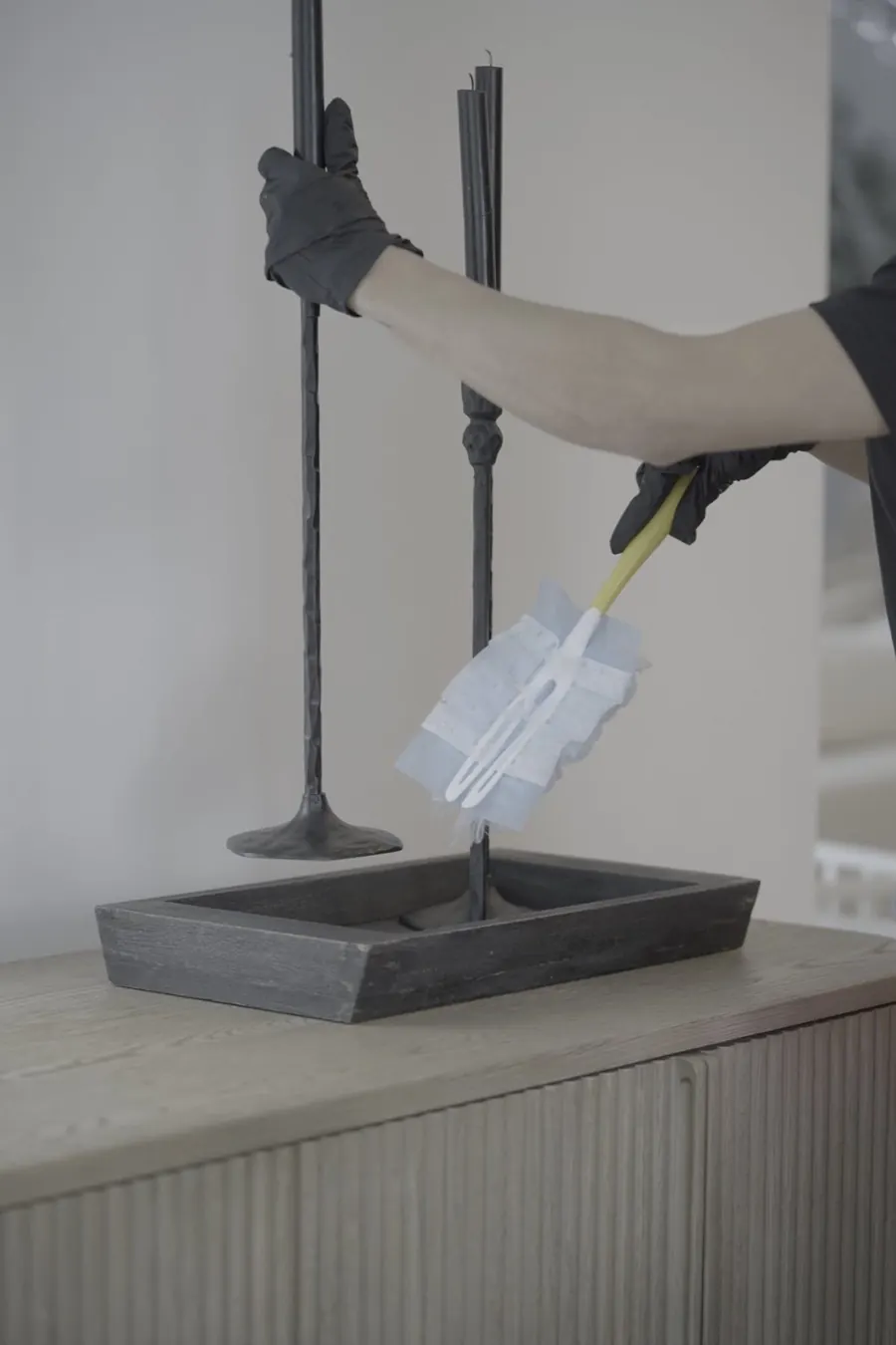 Ingrid's Team cleaner detail dusting a shelf
