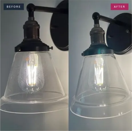 Before and after photo of the glass sconce: Water spots and film cleared. The glass is crystal clear again.